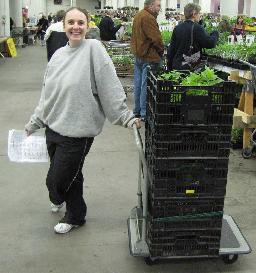 Black plastic crates on an L-shaped cart.