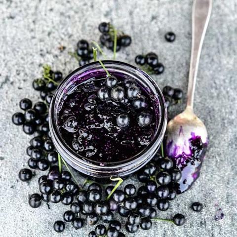 Solanum nigrum Chichiquelite, almost black small round berries in a jar, purple juice