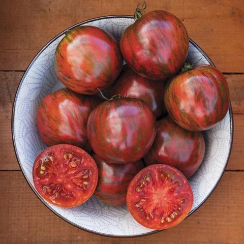 Pink Boar tomato, dark red tomato marbled with green 