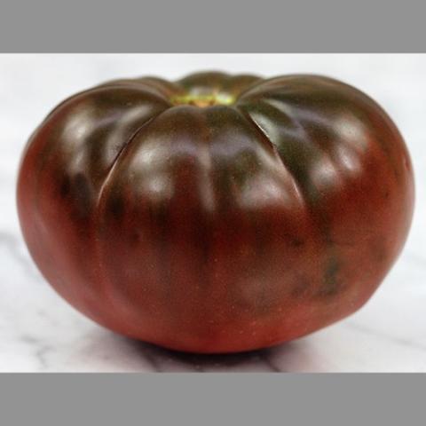 True Black Brandywine tomato, wide flat fruit, very dark purple to dark red